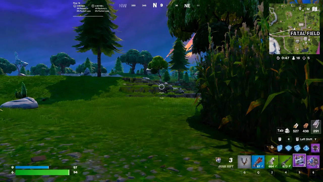 Player lines up a throw with the Junk Rift equipped in the hotbar near a stand of trees