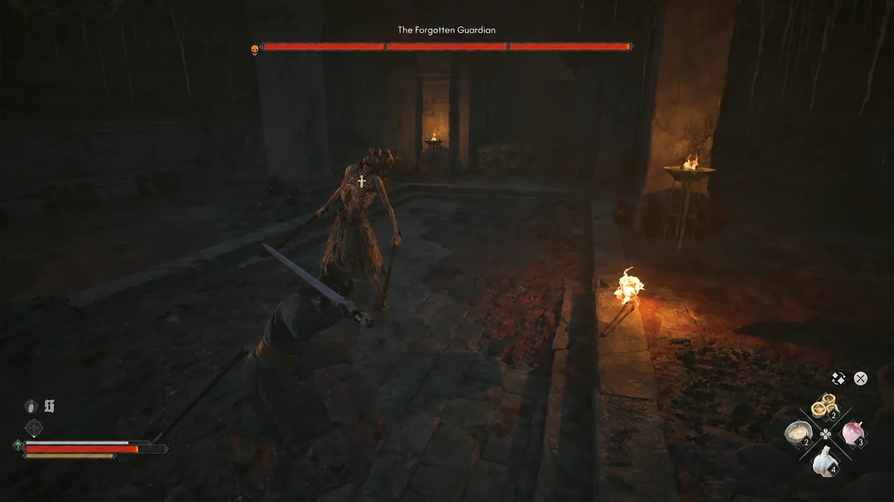 Coen swinging at The Forgotten Guardian with the boss health bar shown at the top of the screen