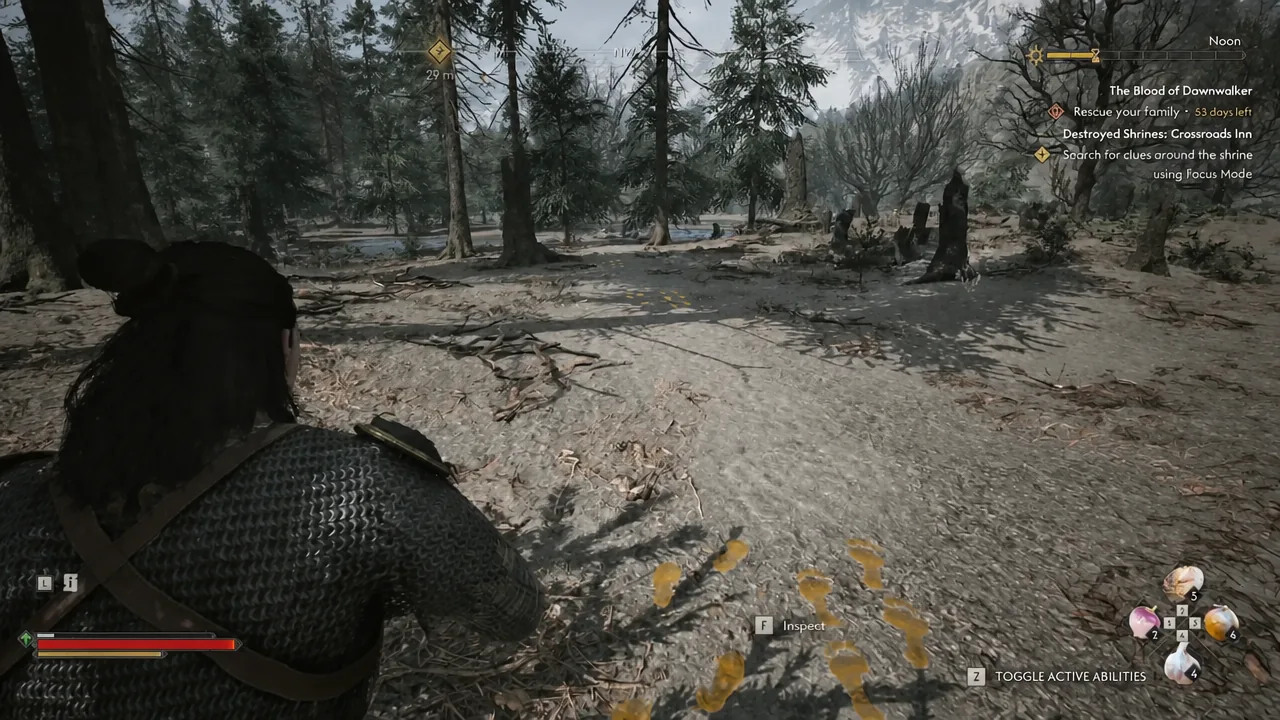 Yellow footprints picked out by Focus Mode with an inspect prompt on screen