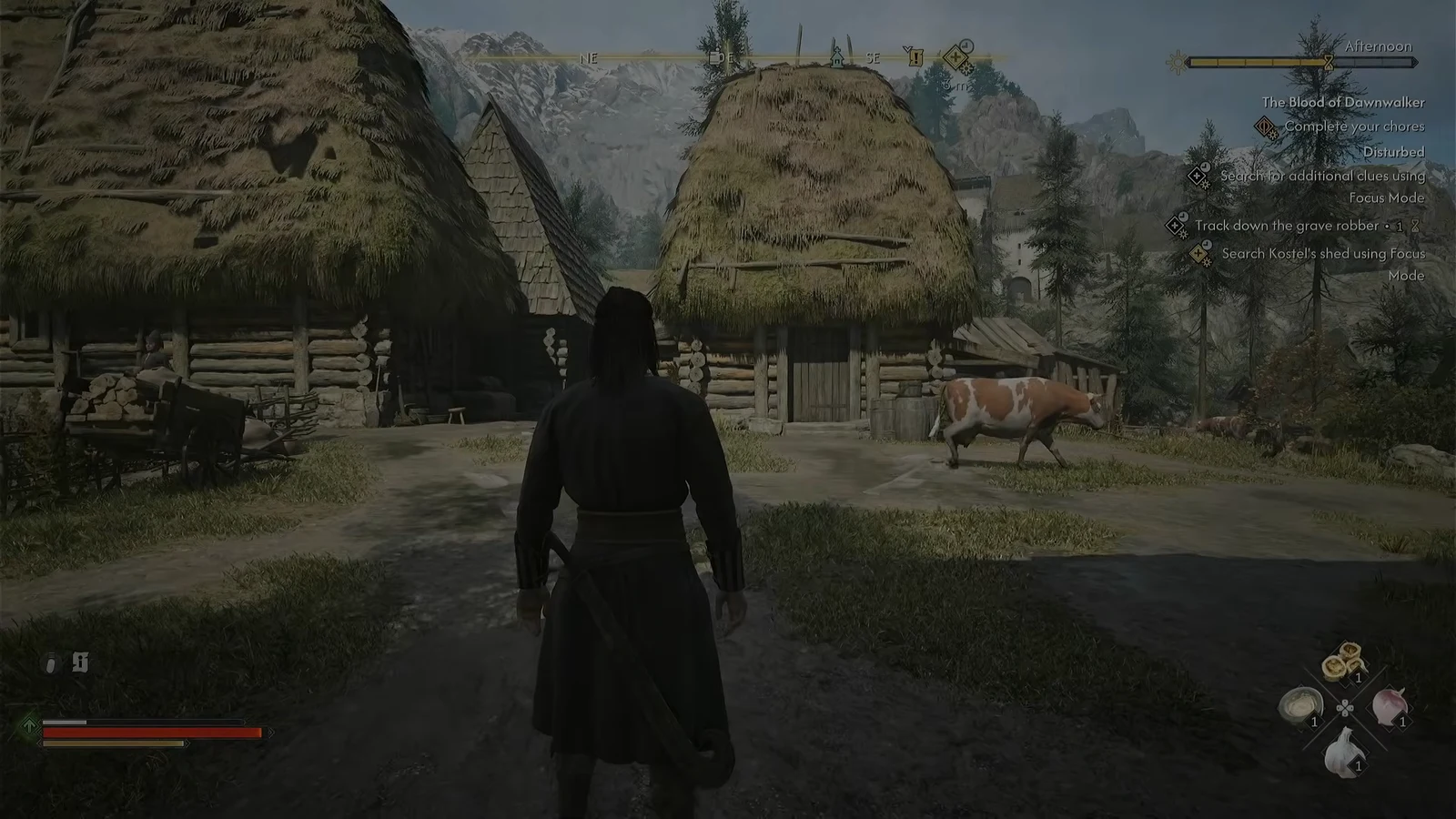 Coen standing outside the village sheds with the Kostel shed objective tracked on screen