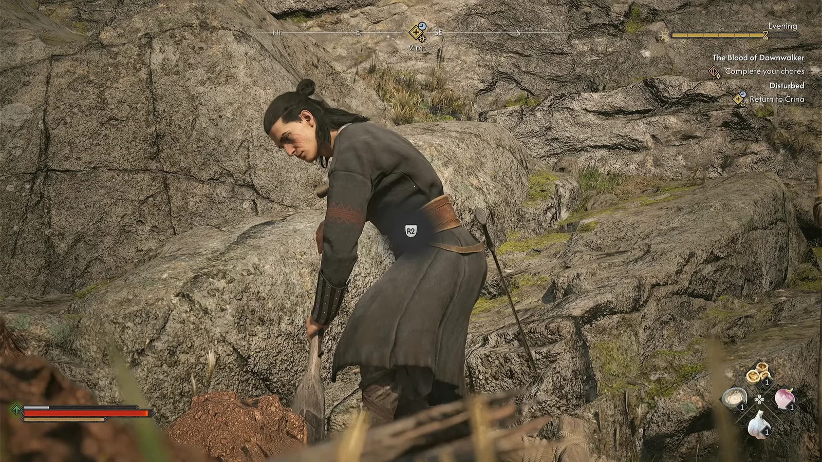 On-screen prompt appearing while Coen digs with a shovel in the rocky ground