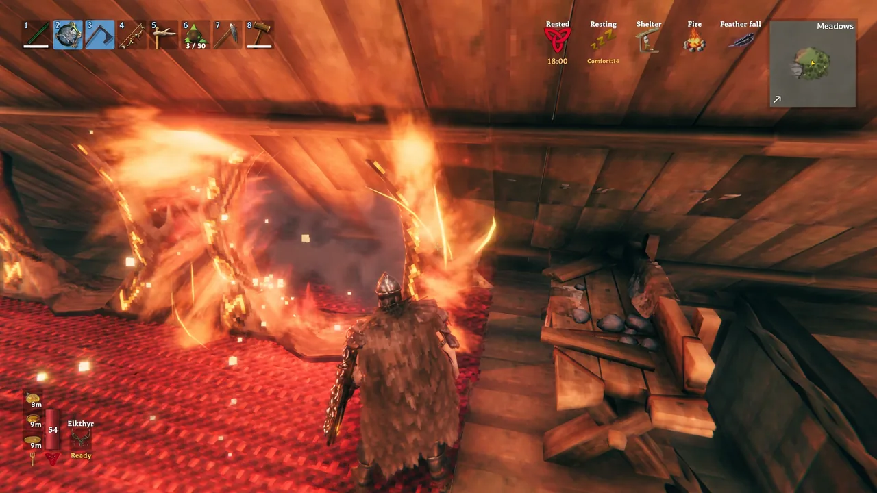 Player standing beside a lit fire inside a wooden shelter in Valheim
