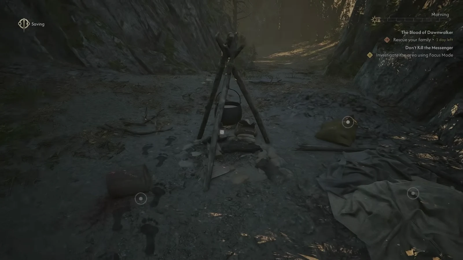 Focus Mode outlining the pot, sack and blanket scattered around the ruined campfire