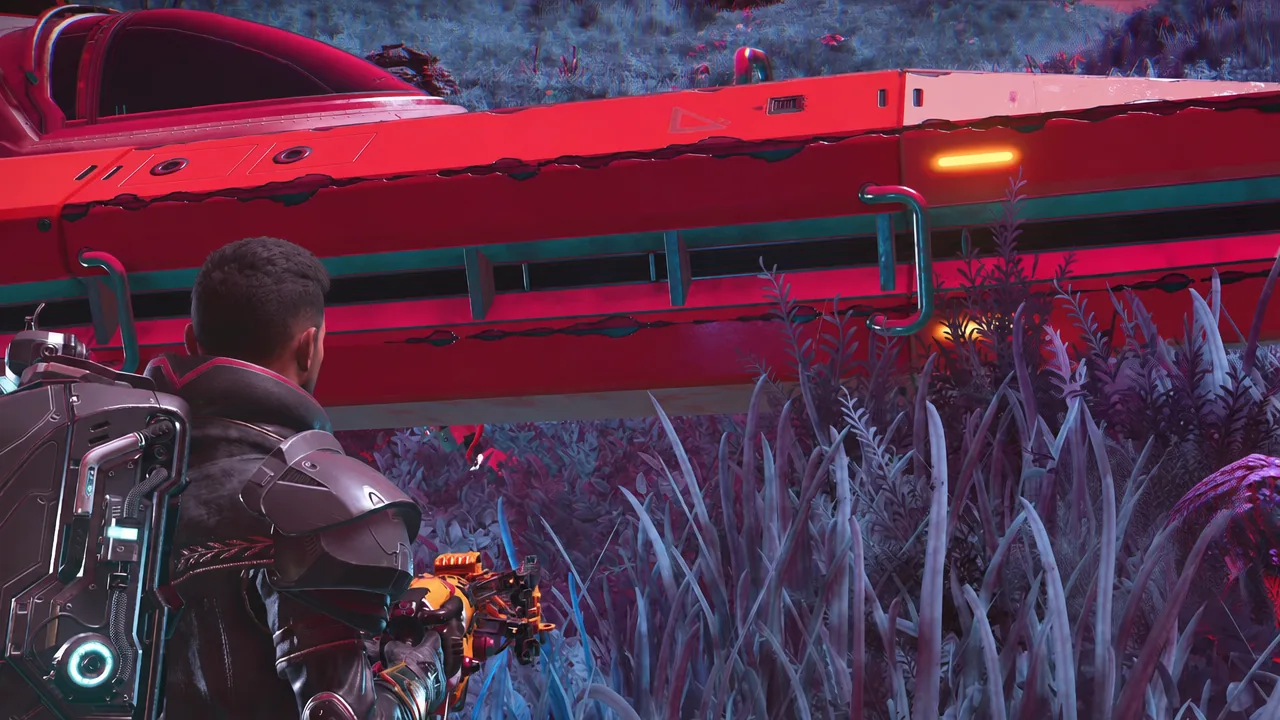 Traveler aiming a weapon on foot next to a large red starship