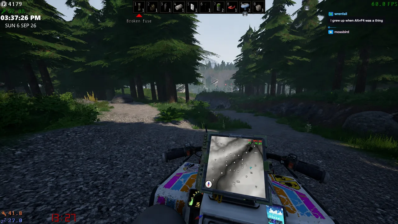 ATV mid-jump on a forest trail during a night drive