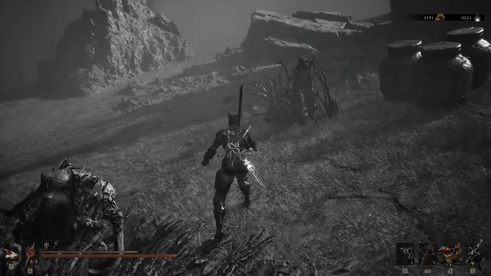 Armored player character fighting through a rocky grass-covered arena during the trial
