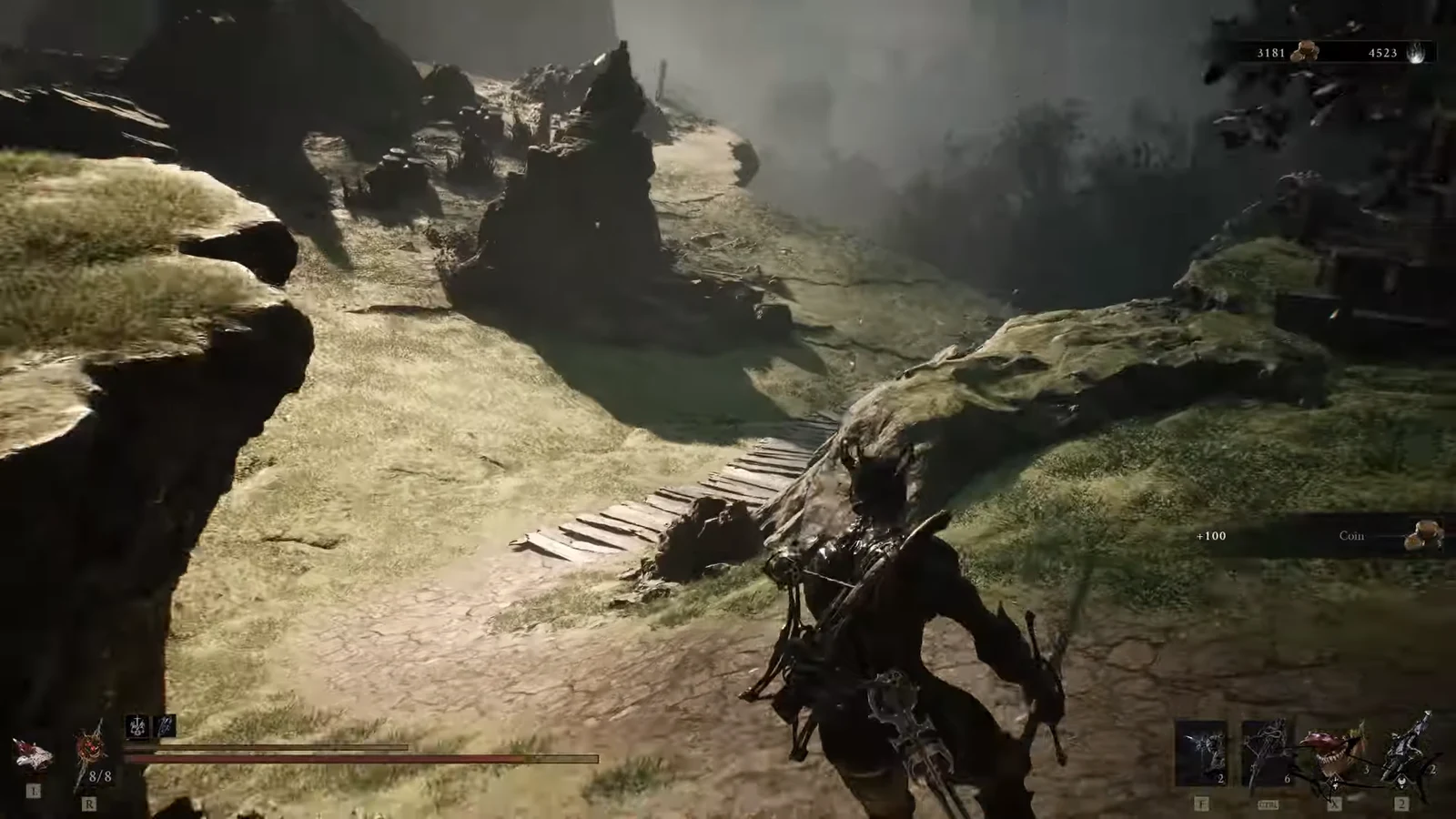 Player running along a rocky cliff path toward a bridge as a +100 Coin pickup appears