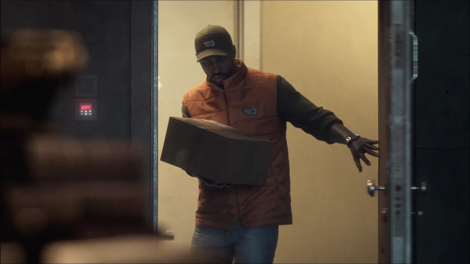 Present day post-credits scene with a delivery worker carrying a package past a wall keypad