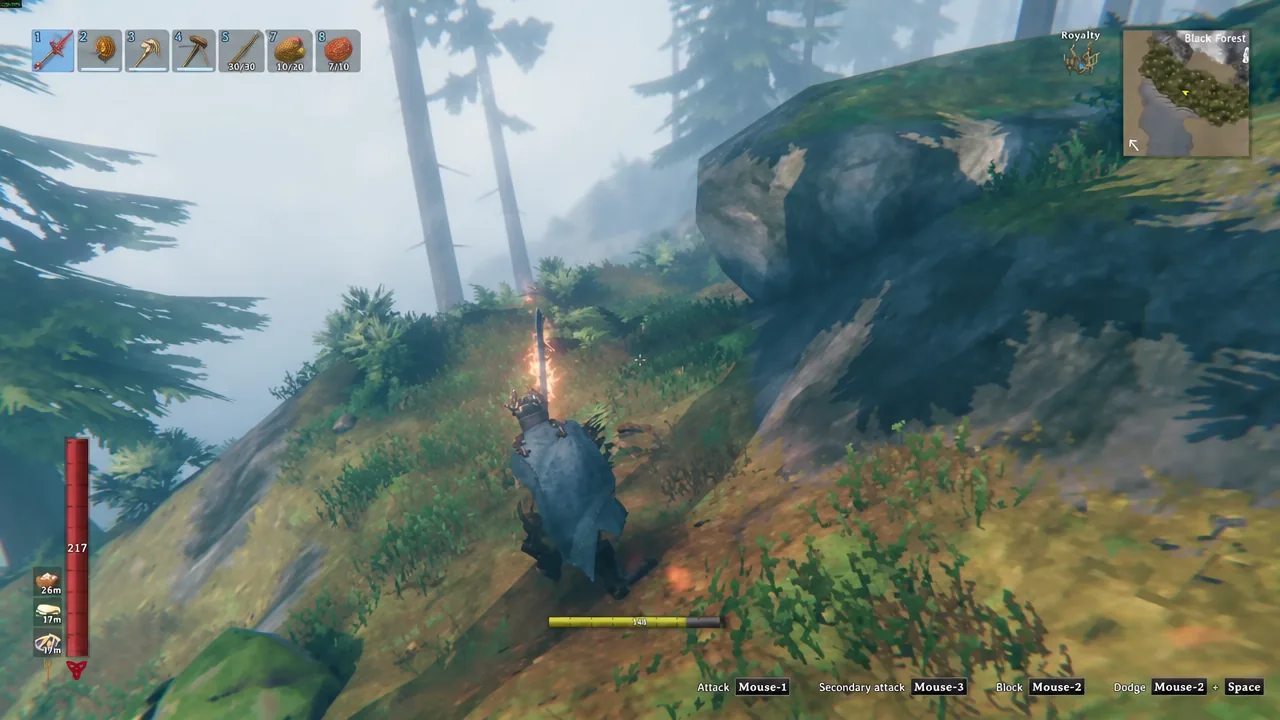 Hotbar slot one shows a sword equipped as the player swings at a grey creature