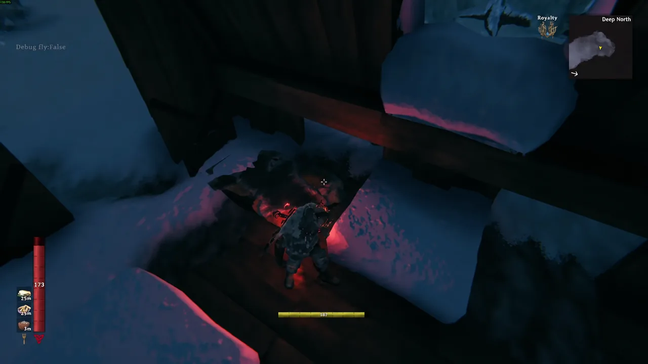 Player in endgame gear fighting a glowing red enemy under a dark stone structure