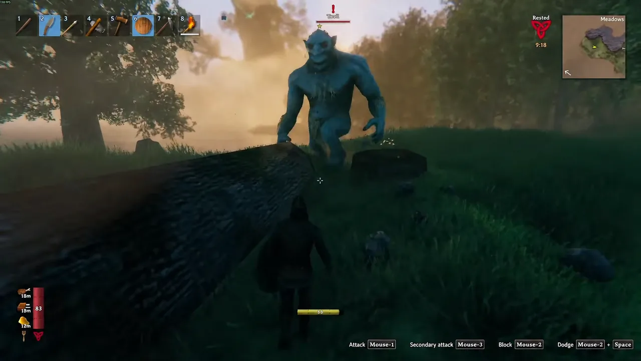 A player fights a Troll in the Meadows with hotbar slot two highlighted