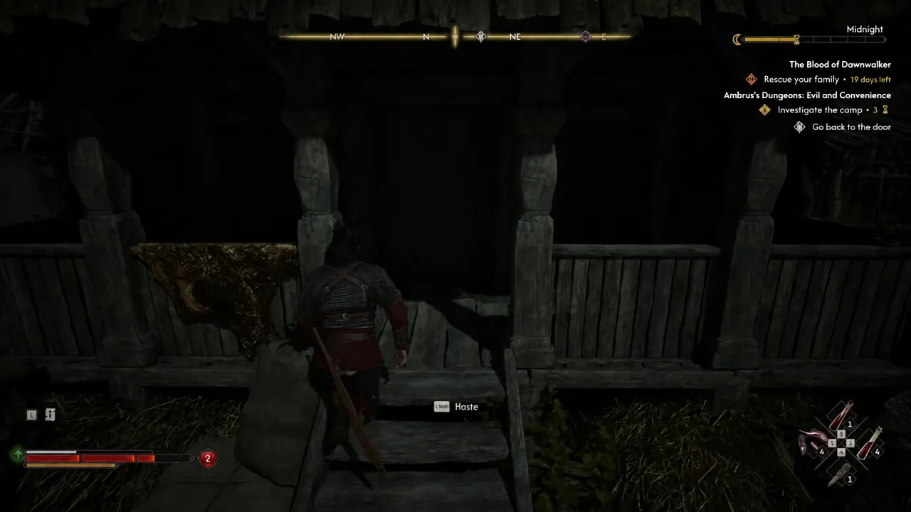 Coen crossing a wooden bridge with the Left Shift Haste prompt on screen