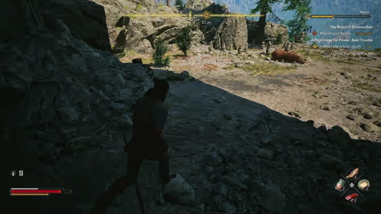 Quest tracker showing the Explore the top of the hill objective while Coen walks a rocky passage