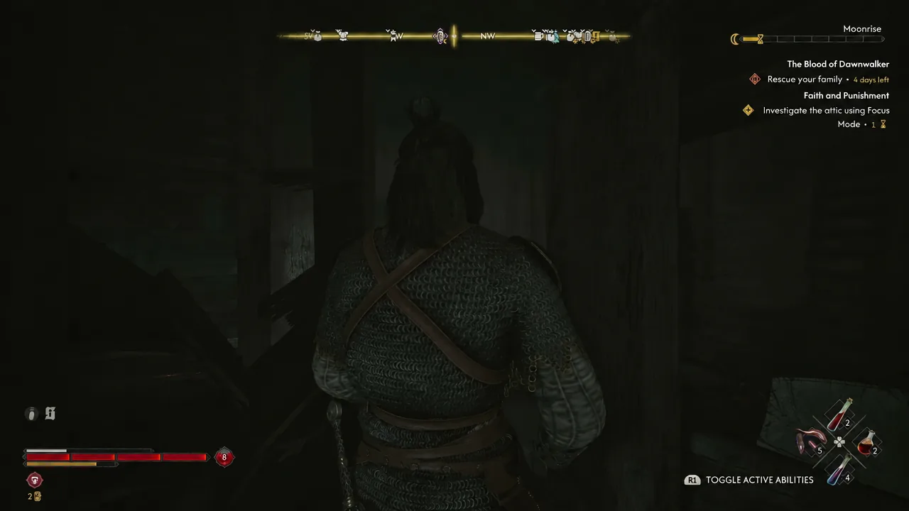 Dark attic interior with the Focus Mode investigation objective still active on the HUD