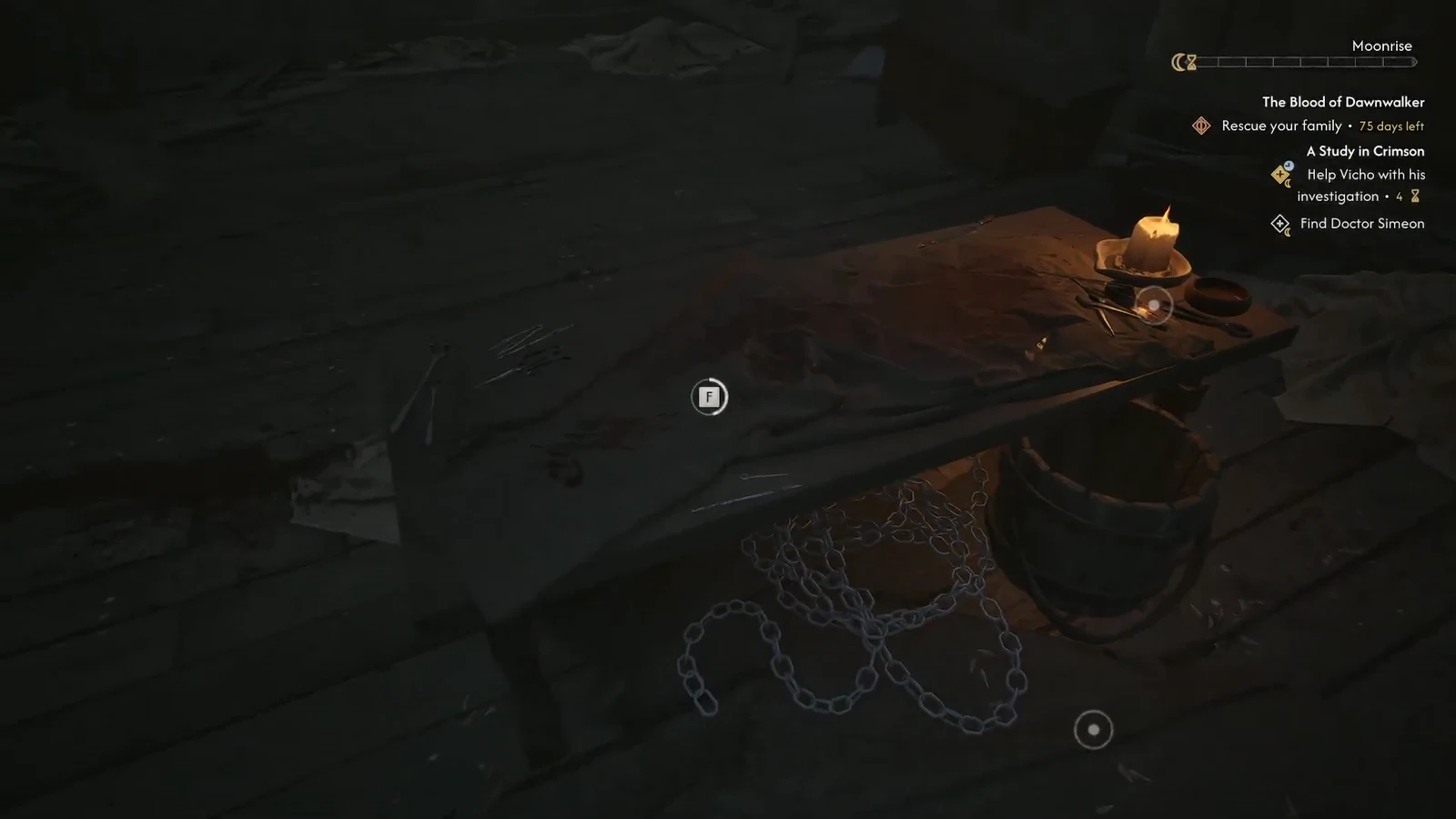 The F interaction prompt showing over the bloodstained workbench on the middle floor