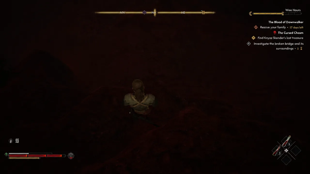 Player moving through the dark chasm floor with the broken bridge objective still tracked on the HUD