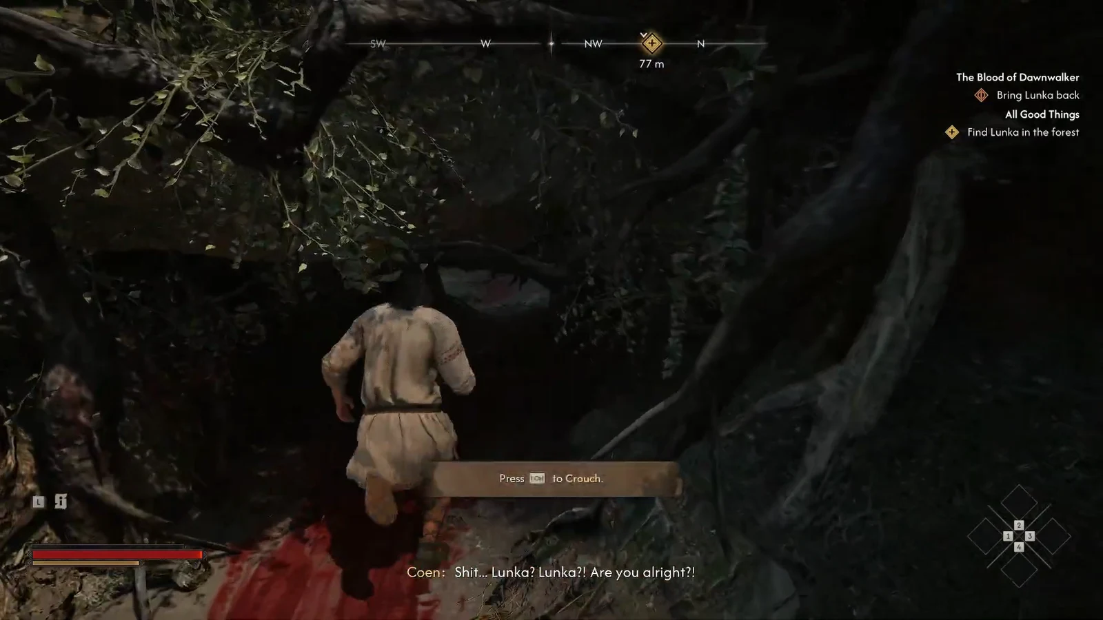 On-screen prompt to press Ctrl to crouch before crawling through the low cave opening