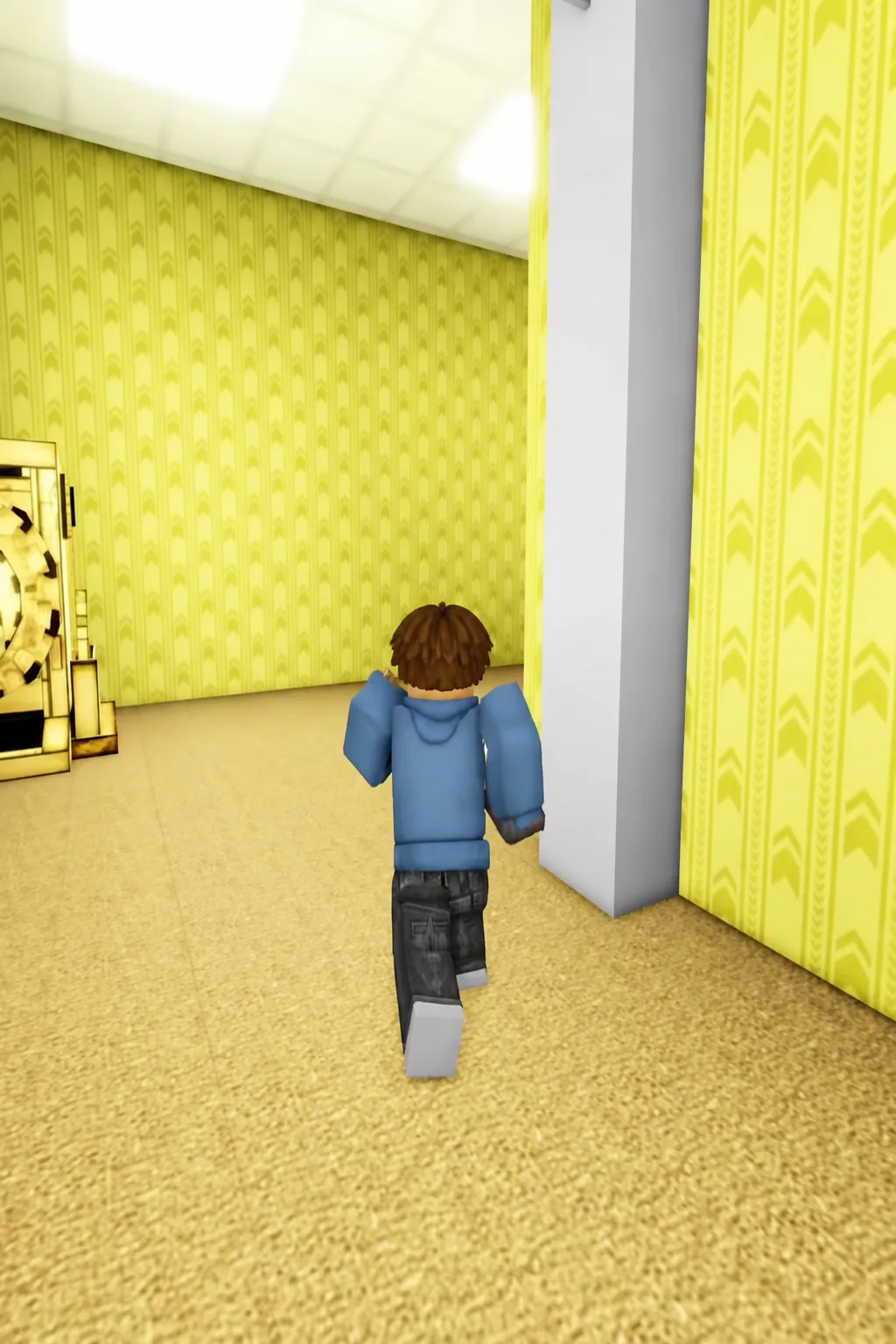 Player running along a patterned yellow corridor toward a side doorway in the maze