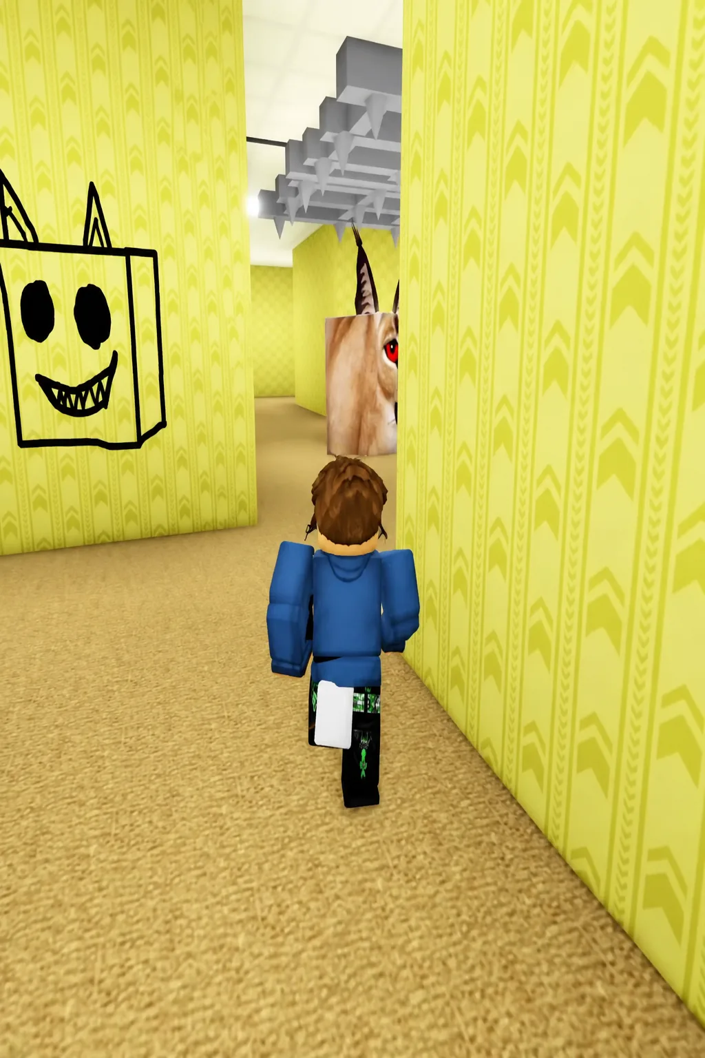 Player approaching the giant Floppa head in a yellow Backrooms corridor under a ceiling cage