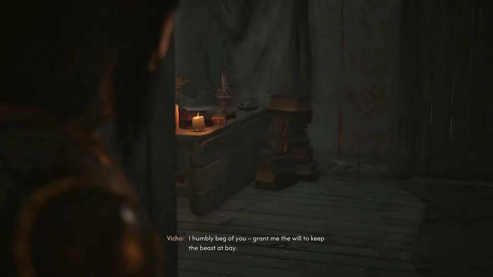 Vicho kneeling in a candlelit room, praying for the will to keep the beast at bay