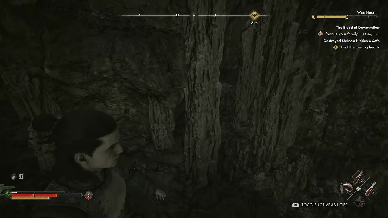 Cave interior with the button prompt for toggling active abilities visible on screen