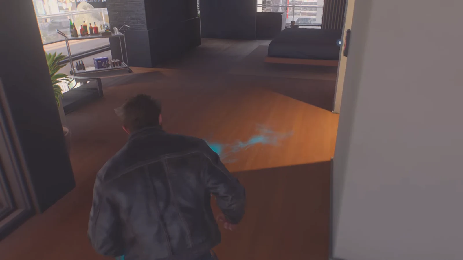 Logan crouches low and follows a glowing blue scent trail across the floor of Shiro's apartment