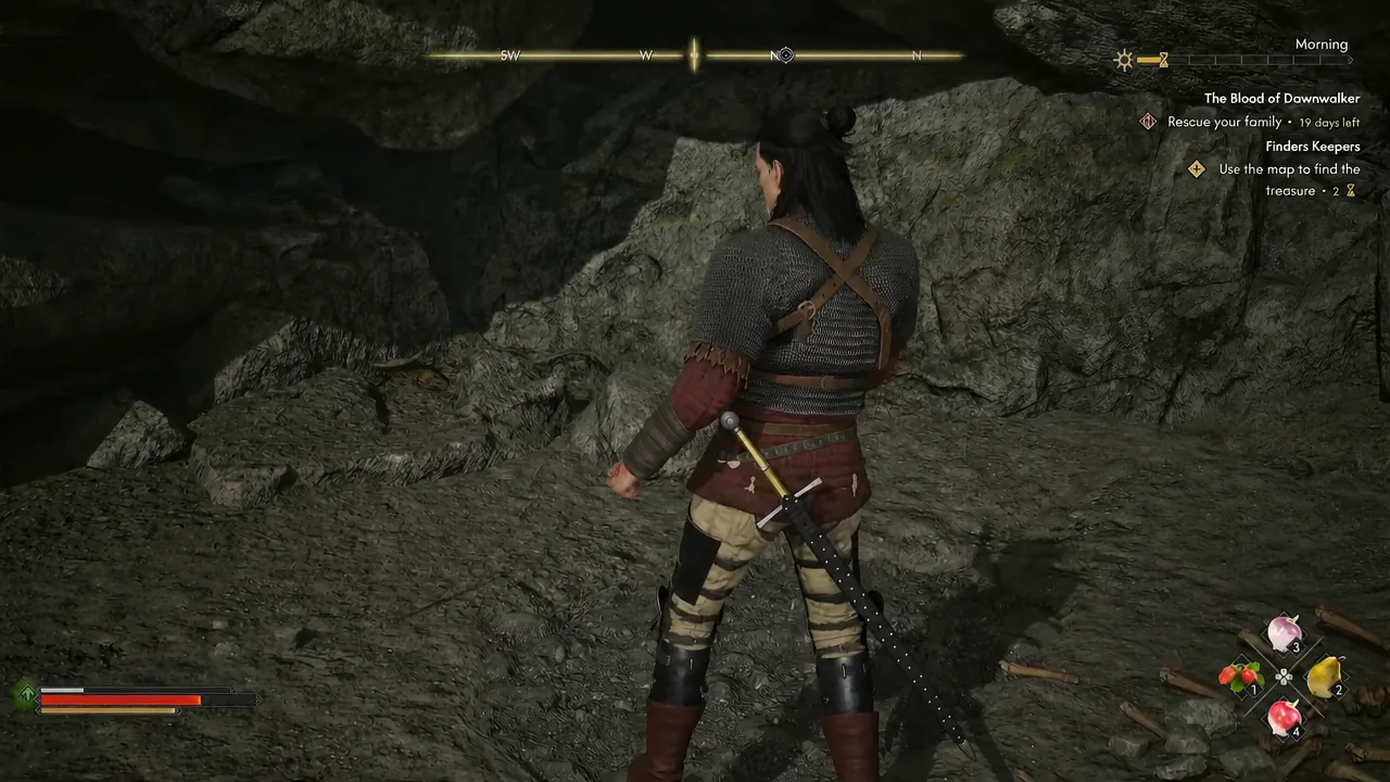 Coen inside the shallow cave under the rock with the Finders Keepers treasure objective displayed
