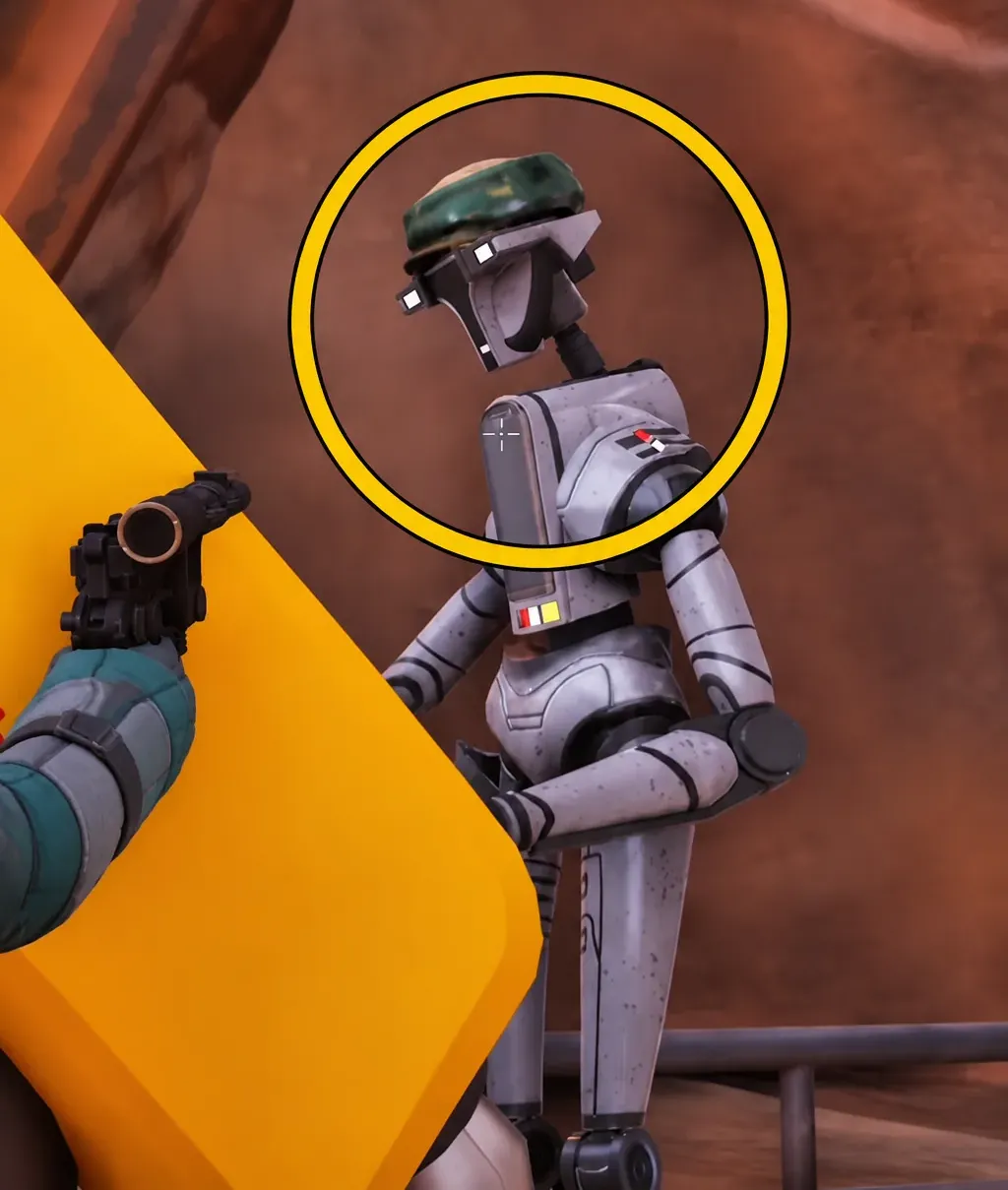 A droid NPC inside the cave highlighted by a yellow targeting circle