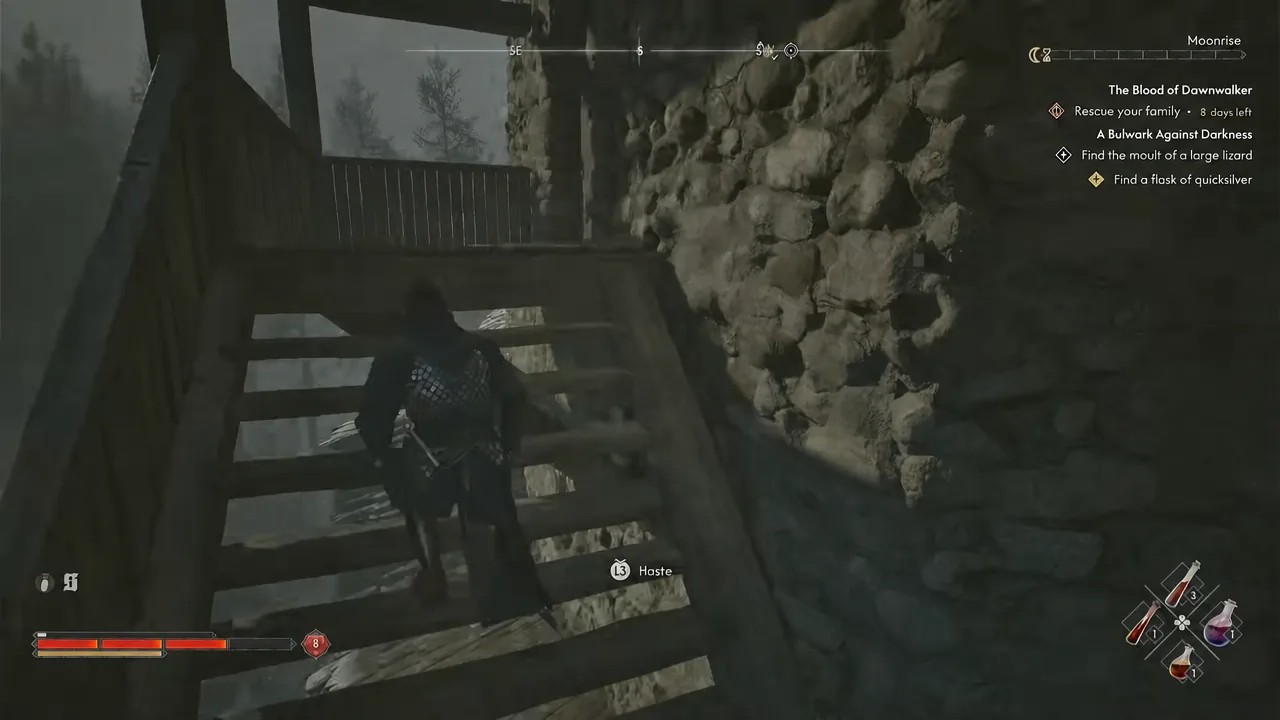 Coen climbing the last flight of wooden stairs toward the tower's top floor