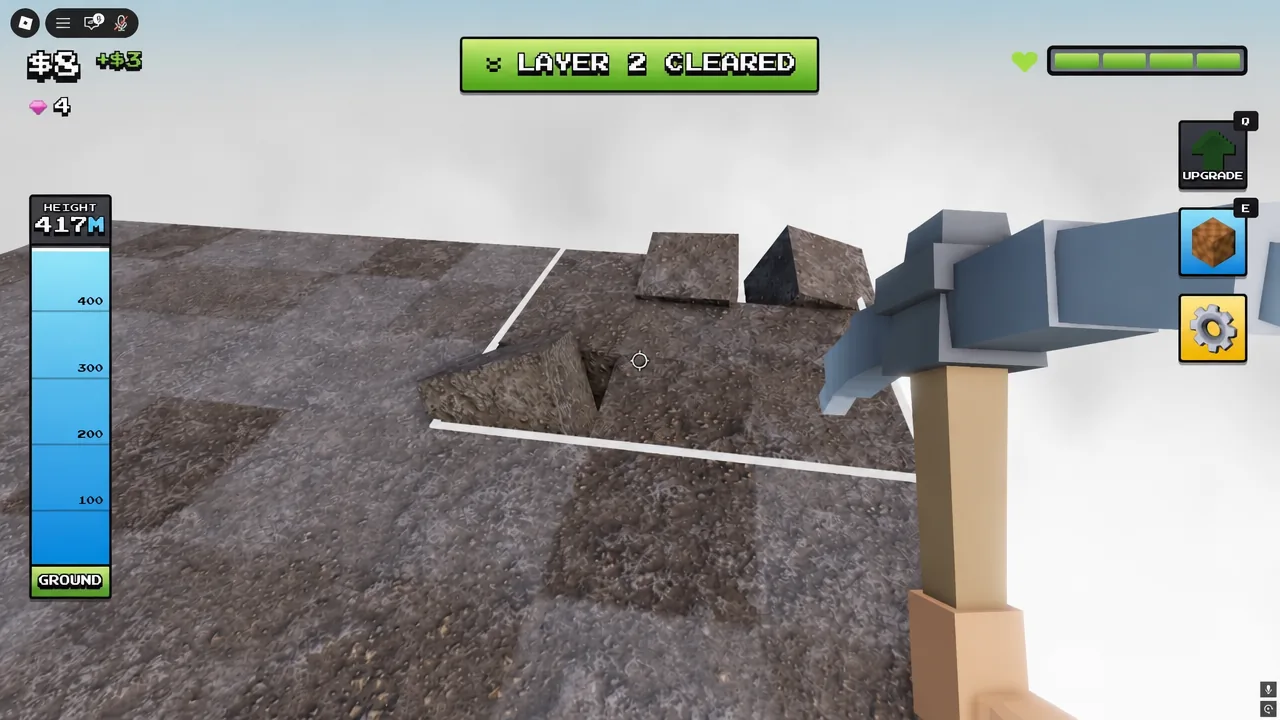 Gameplay screen showing the LAYER 2 CLEARED banner as the pickaxe breaks rocky blocks