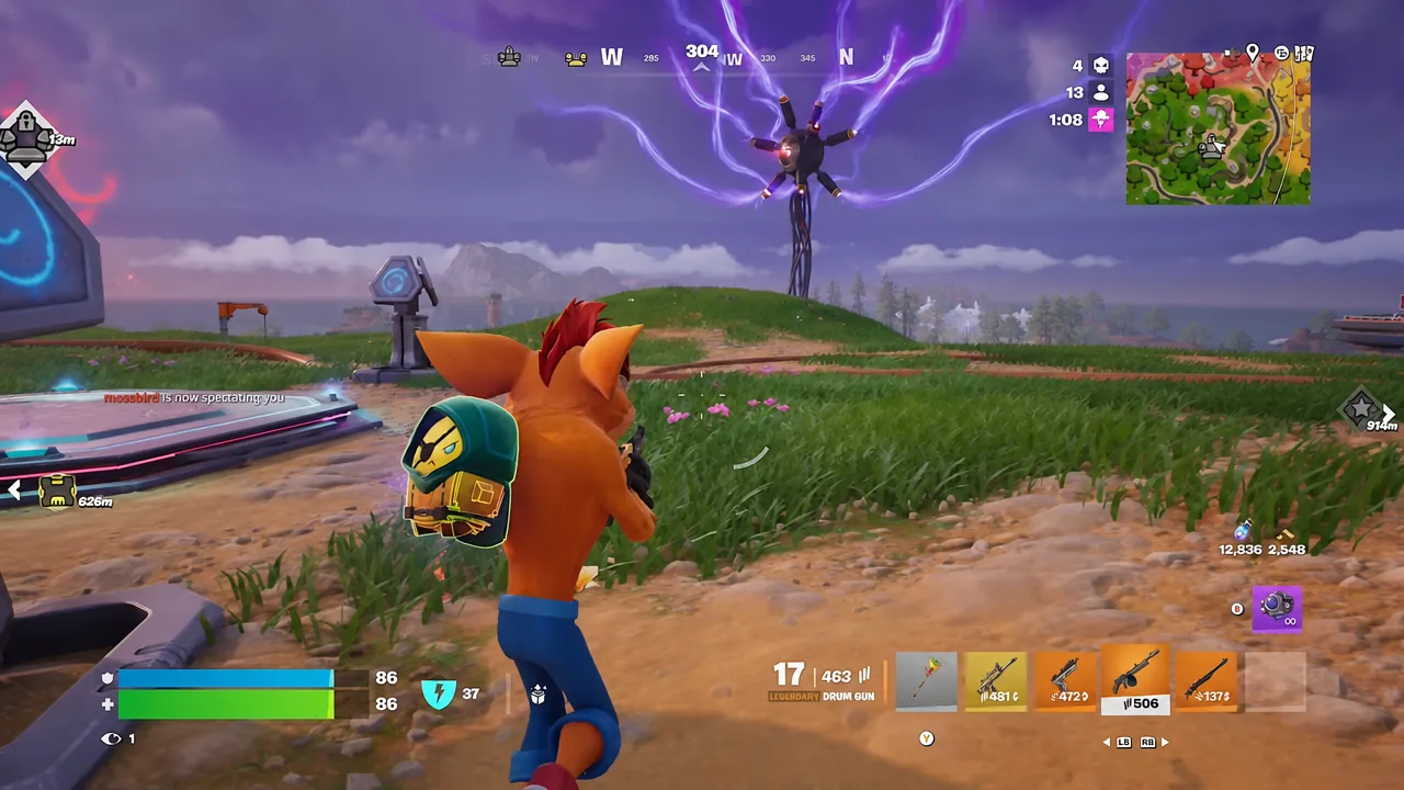 Drum Gun selected in the Fortnite inventory bar while the player aims across a grassy field