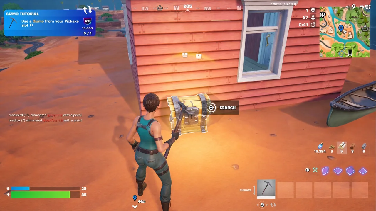 Player landing at a red house on a cliffside in Fortnite and looting a chest