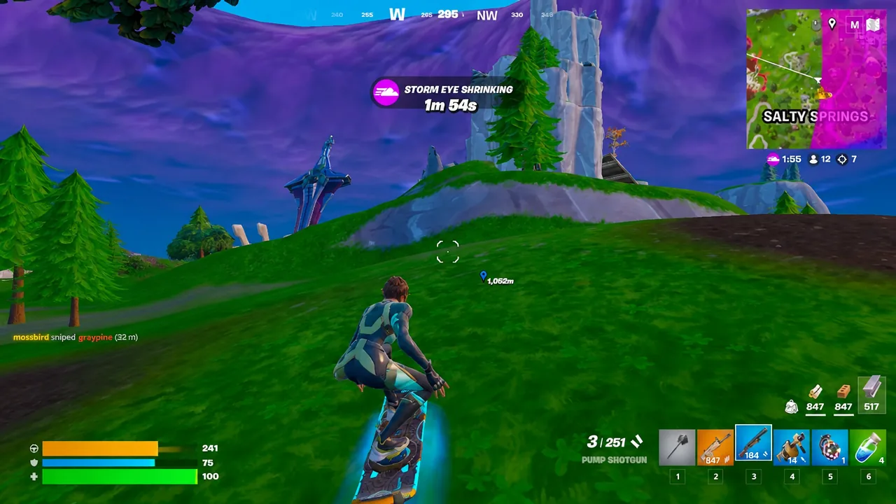Player riding uphill on a Driftboard with a Pump Shotgun in inventory slot three as the storm closes