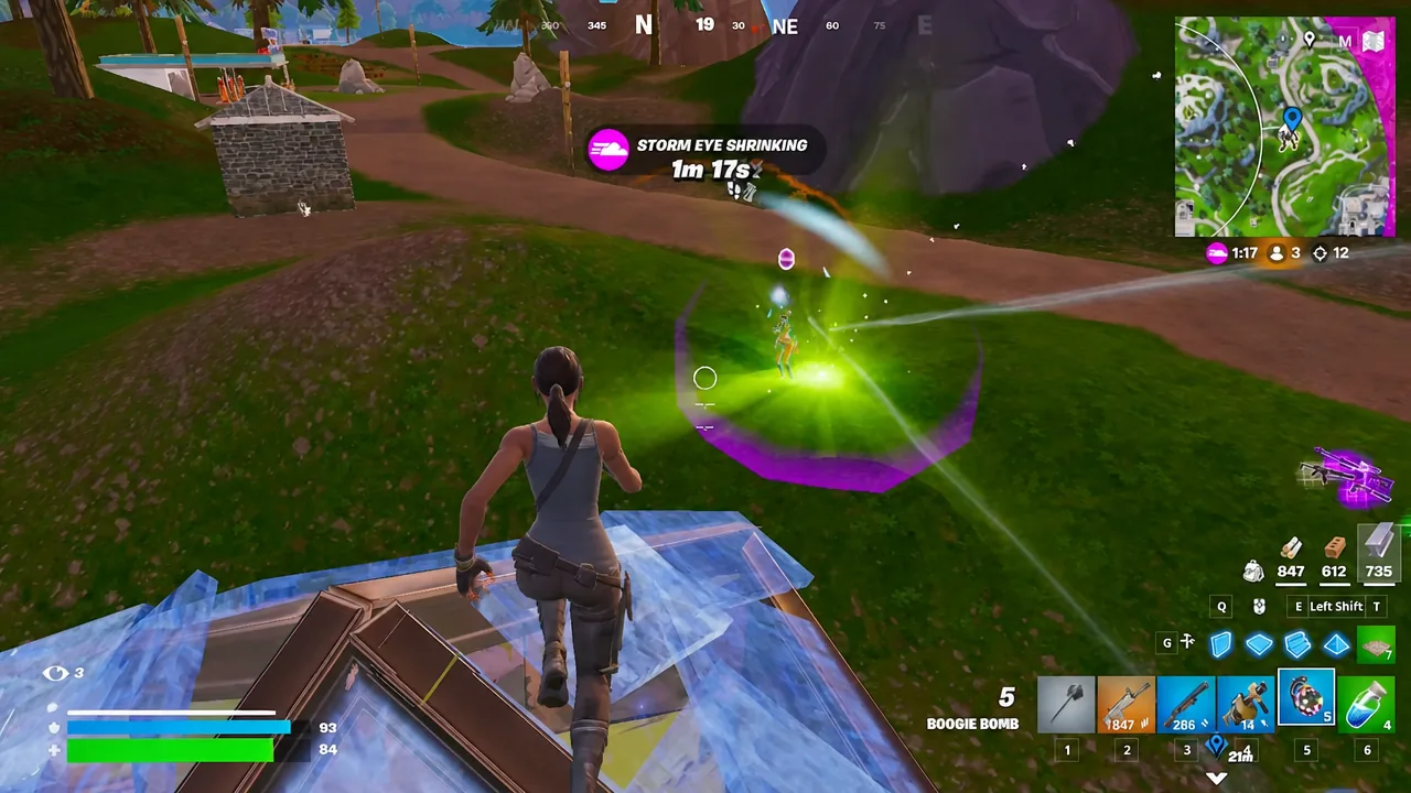 Boogie Bomb selected in inventory slot five and aimed at an enemy build in the late game