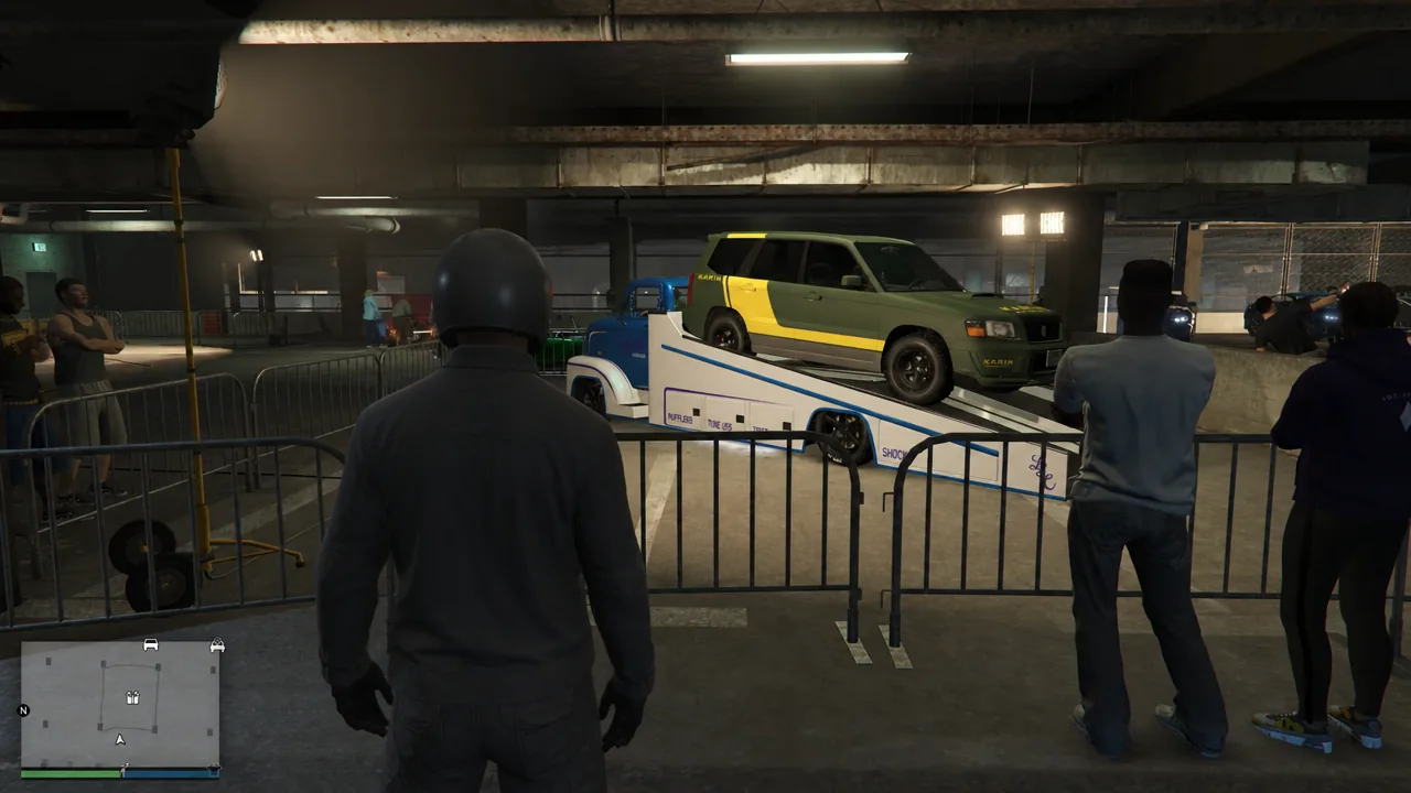 Green SUV displayed on a raised transporter ramp at the LS Car Meet