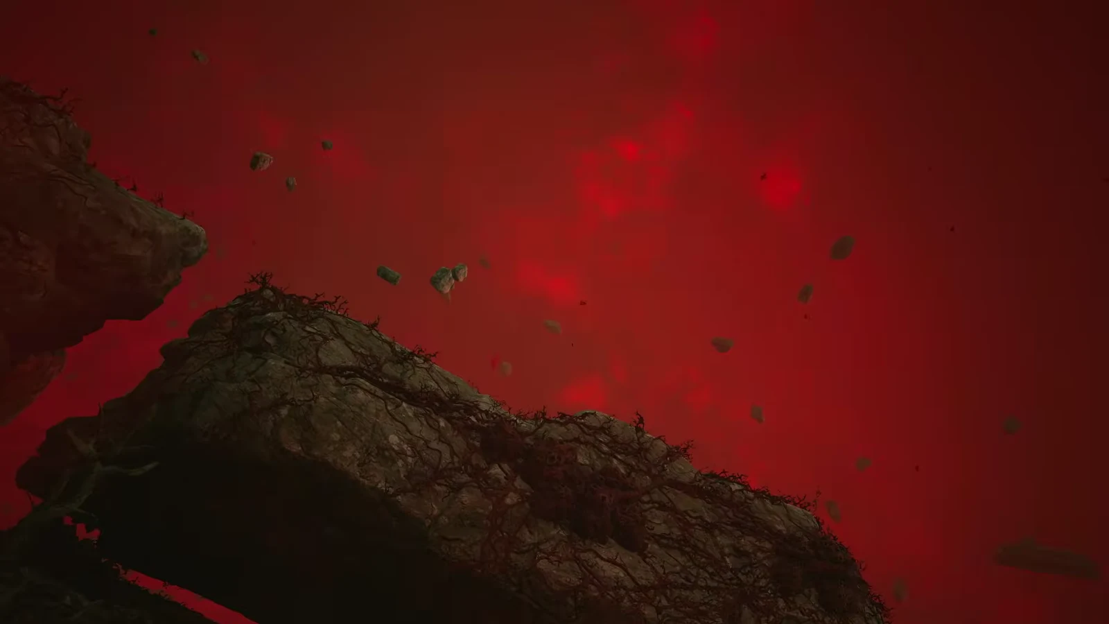 Coen speaking with Bakir's soul in the red-lit spirit realm of Anachora