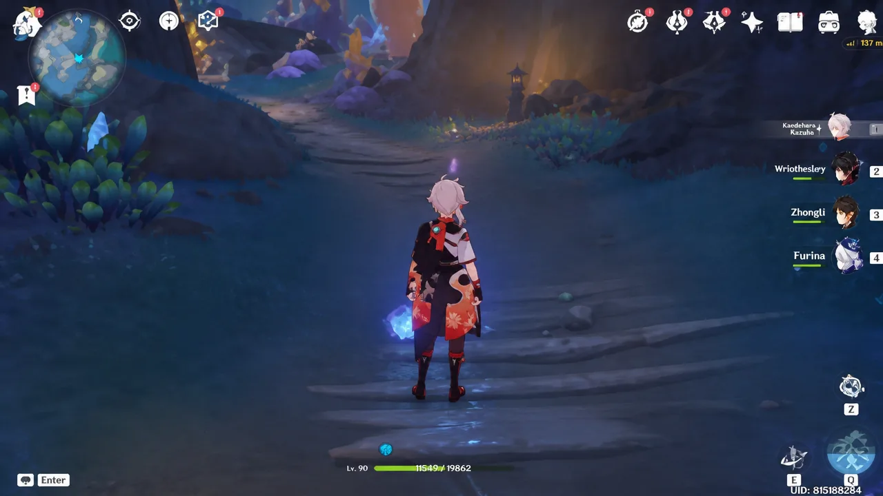 Kazuha standing on a cavern path in Genshin Impact with the party HUD visible