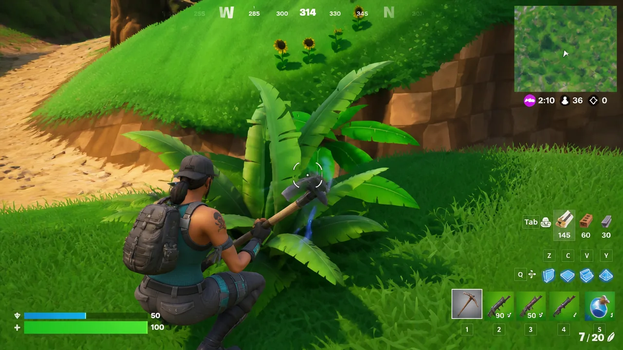 Player swinging a pickaxe at a large plant while looting around the landing spot in Fortnite