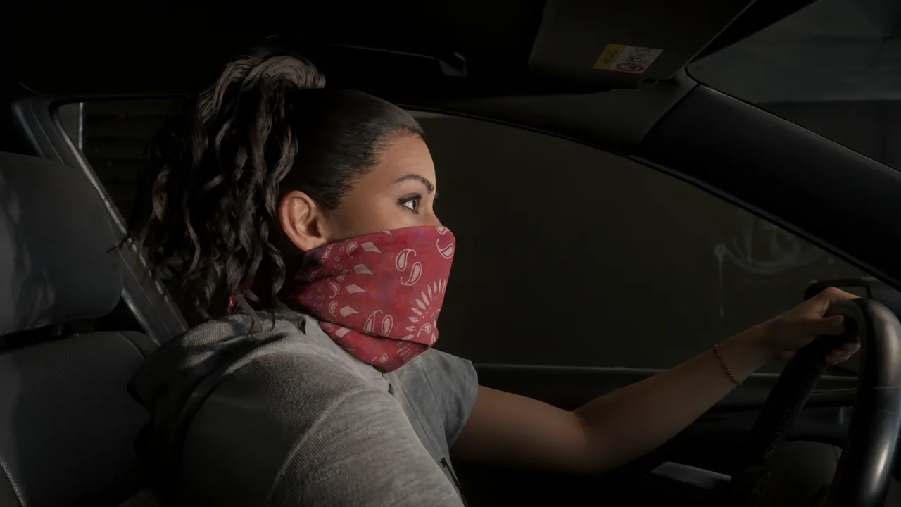 Jason firing an assault rifle from the car window at pursuing police vehicles