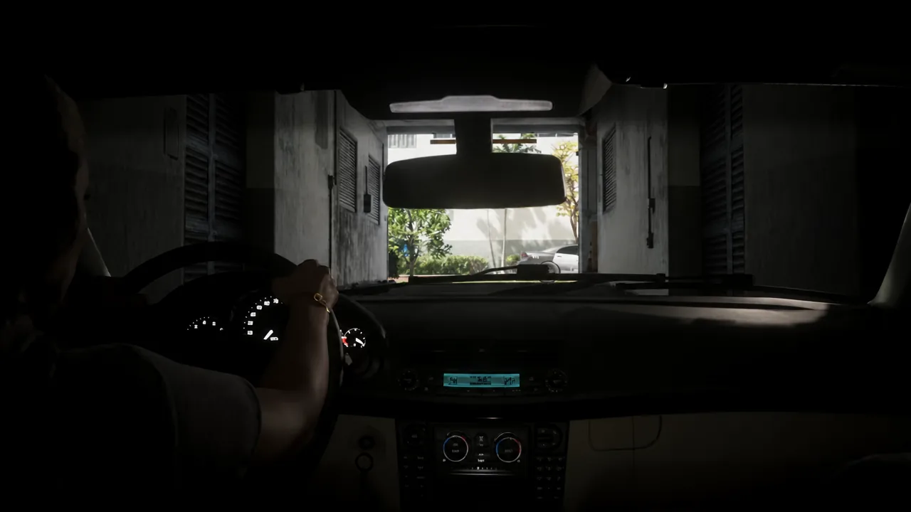 Third-person driving view as the getaway car pulls out of the covered alley garage