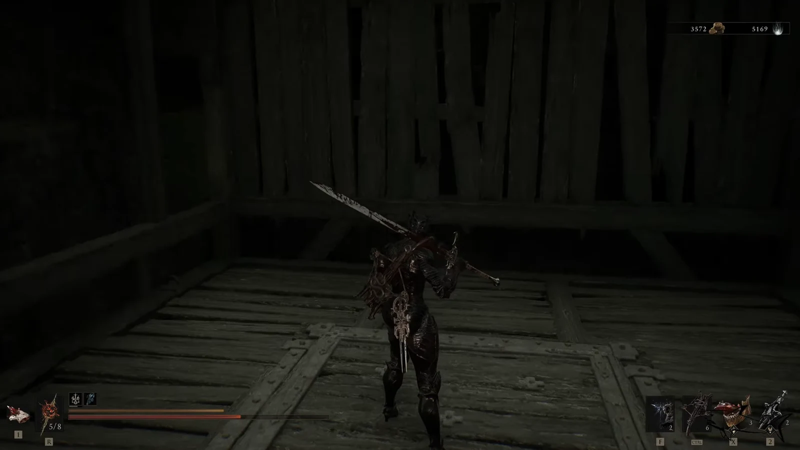 Armored Shell with a large sword standing on the dark wooden lift descending into the pit