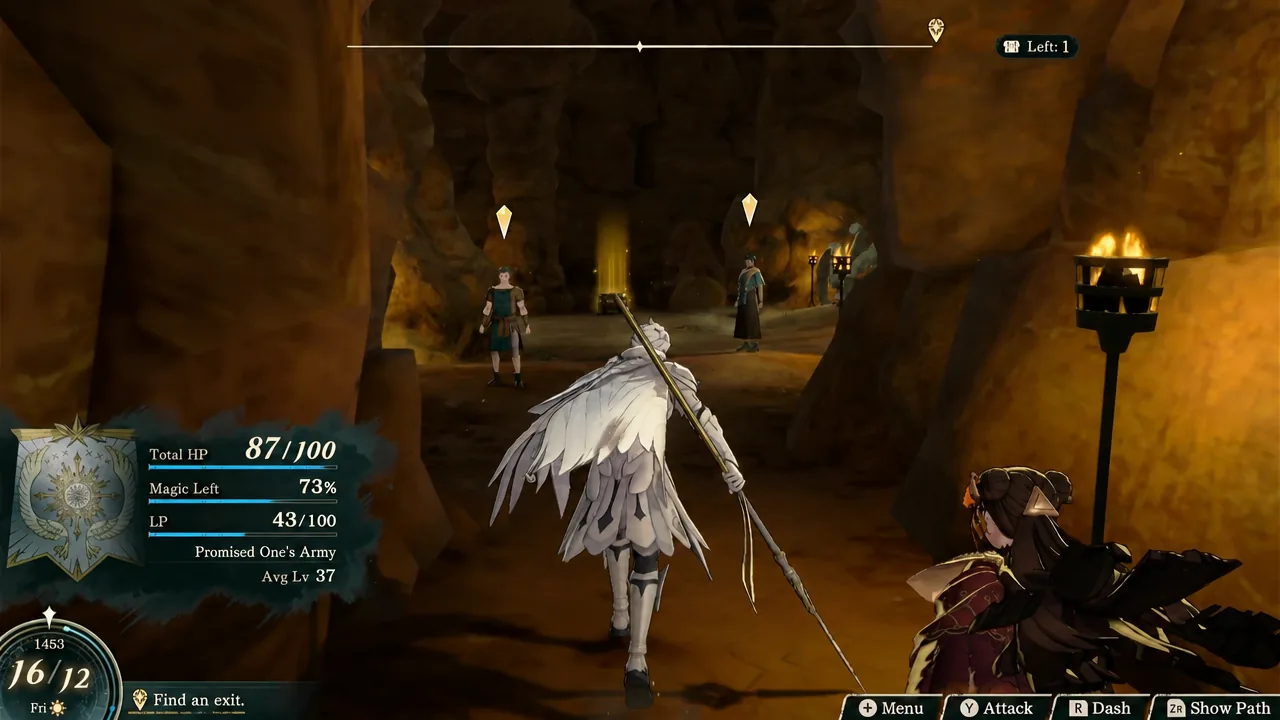 Two marked survivors standing in the torch-lit cave passage just before the chest