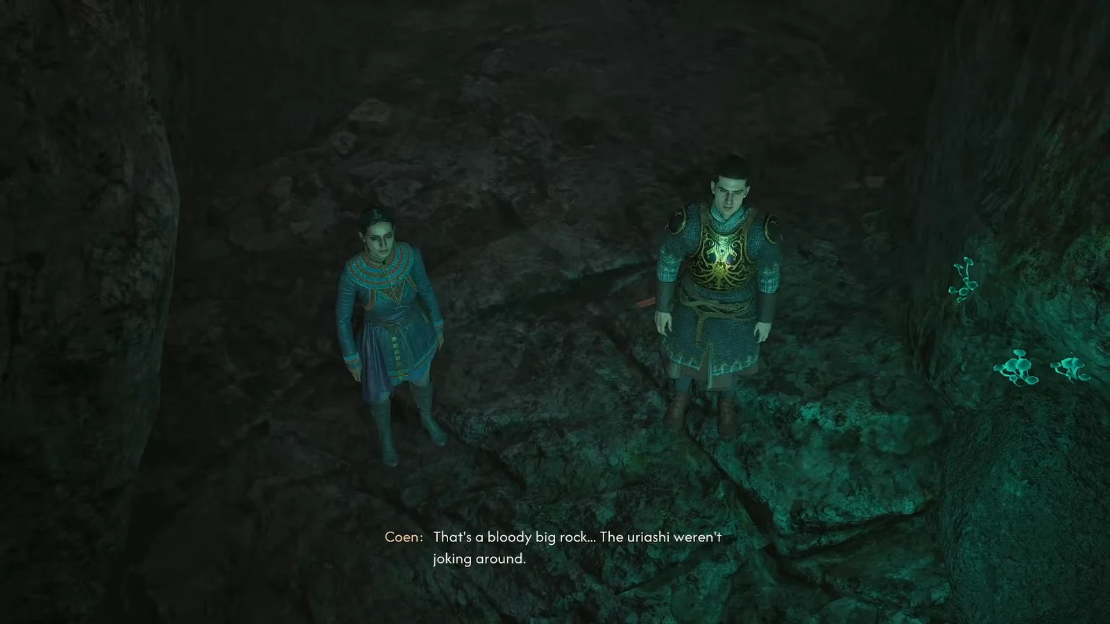 Coen and Lacra stand in front of the boulder blocking the cave tunnel during a cutscene