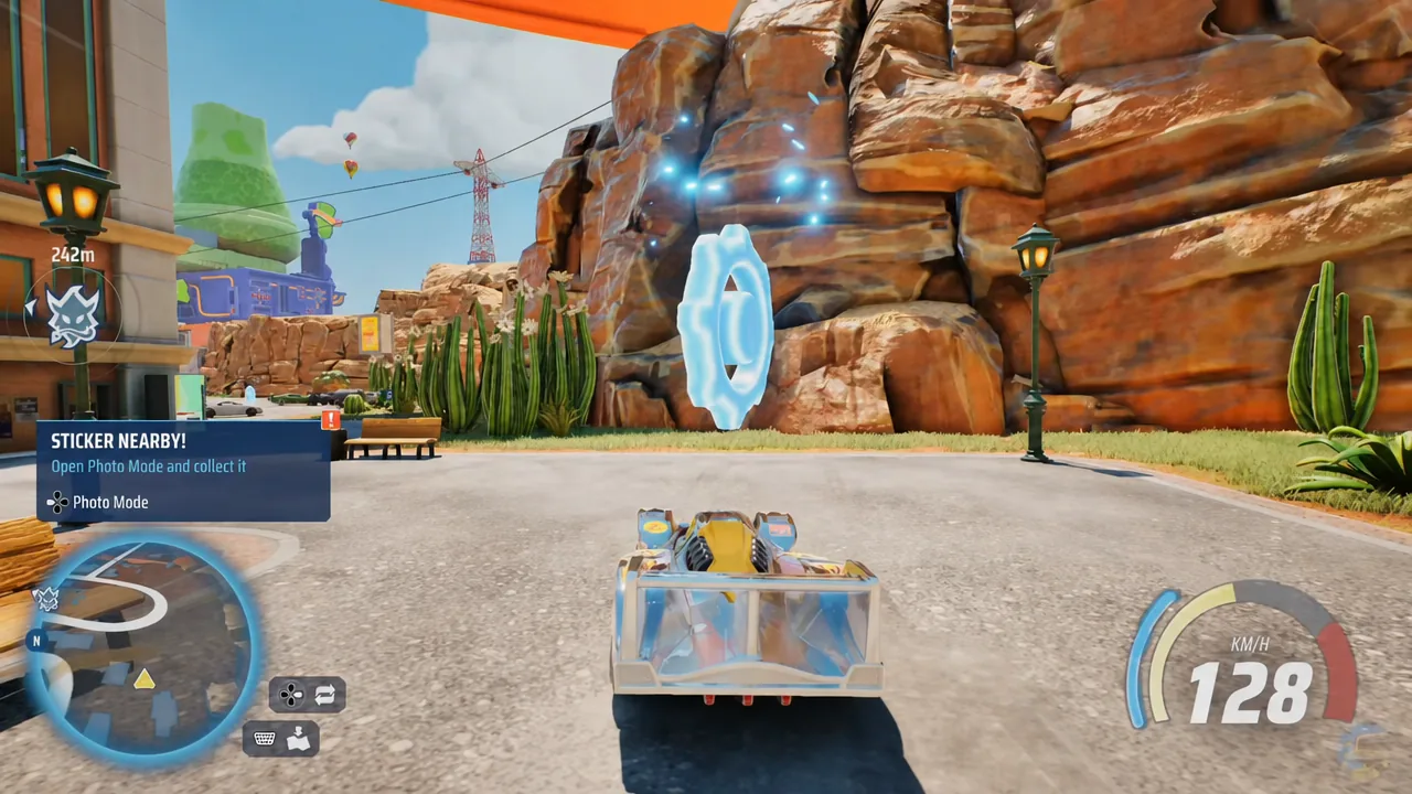 On-screen prompt telling the player to open Photo Mode to collect a nearby sticker