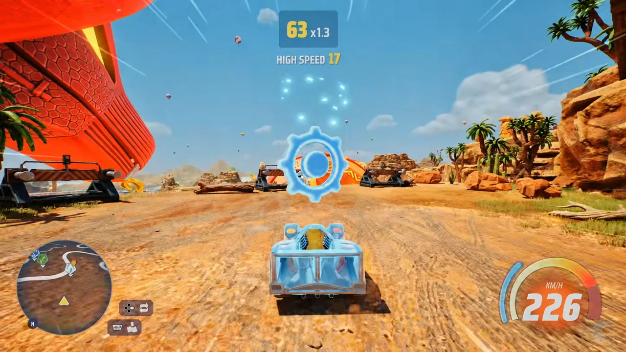 Car driving at speed toward a glowing gear-shaped collectible floating on the track
