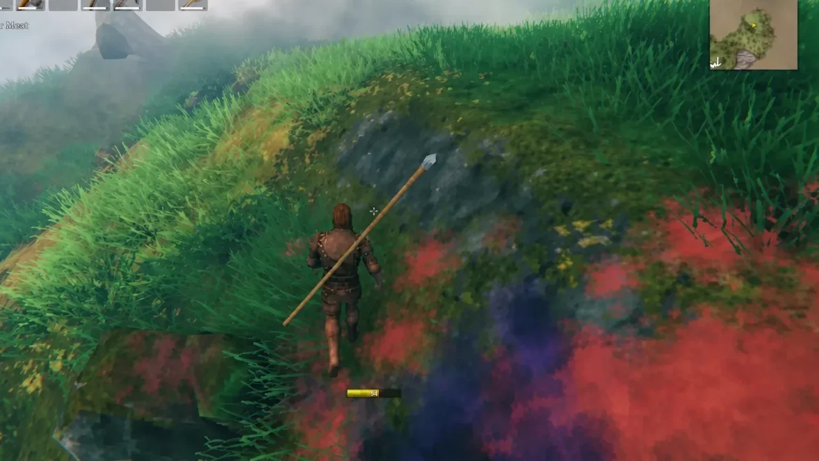 Valheim character climbing a grassy slope with spear equipped and minimap visible