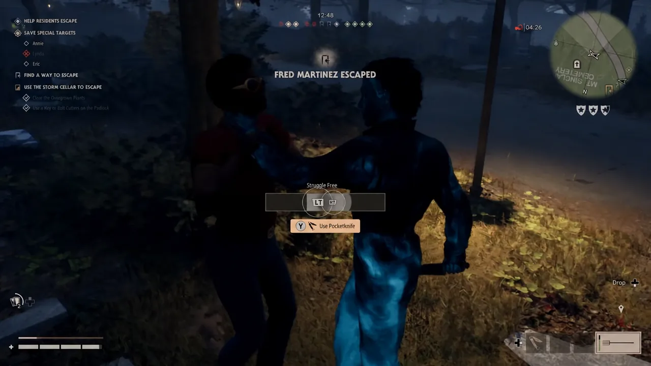 Struggle Free prompt on screen during a Michael grab, with the Use Pocketknife button highlighted but unused.