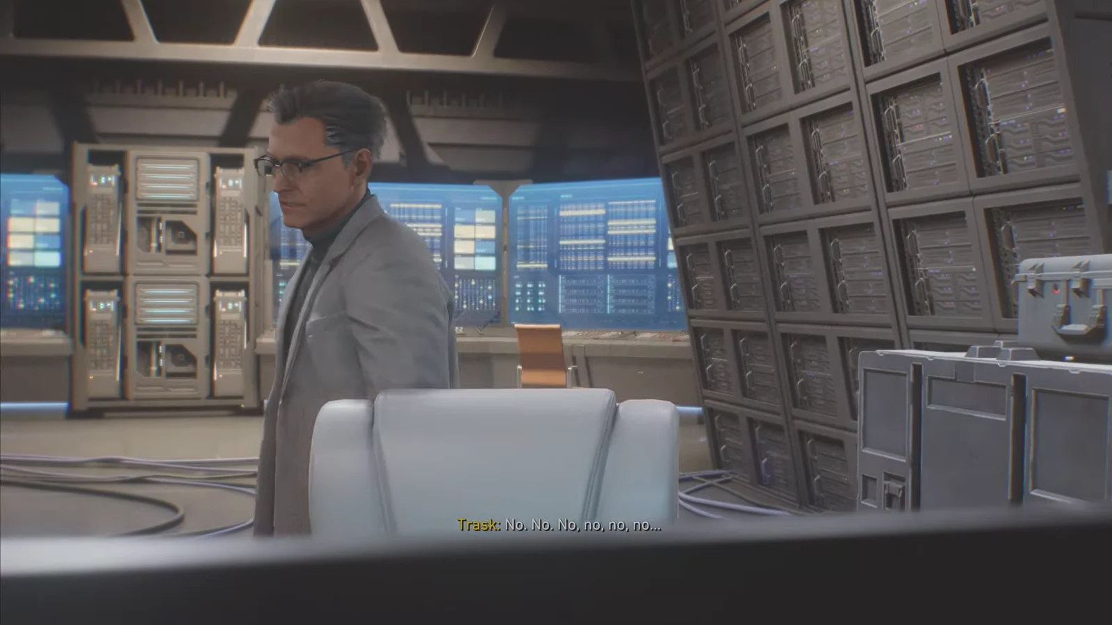 Trask in a high-tech server room reacting during the Sentinel Prototype's defeat