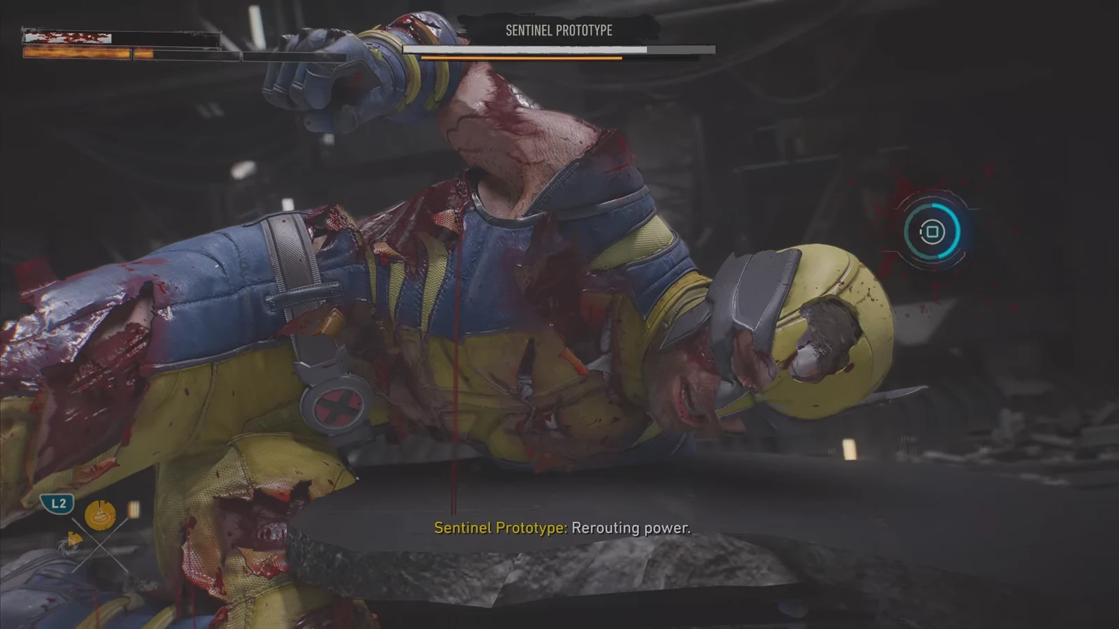 On-screen button prompt appearing as the Sentinel Prototype charges power during the boss fight