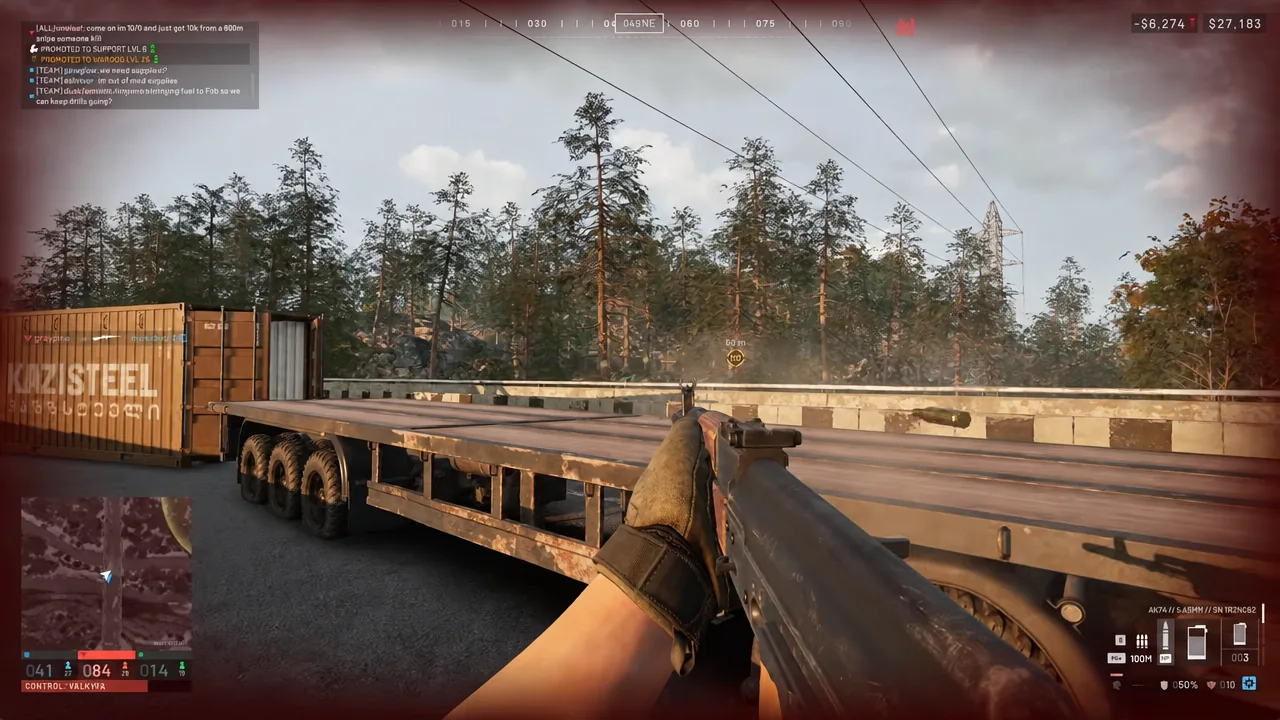 Player aims a shotgun over a flatbed trailer toward the marked objective during a firefight